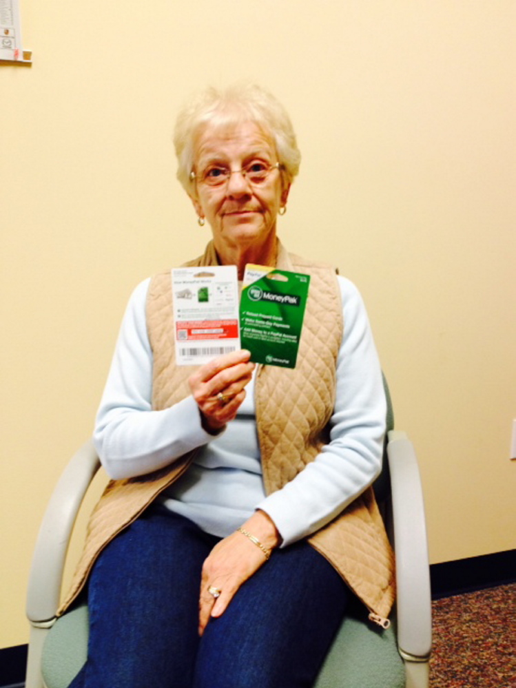 Rose Bickford, of Fairfield, holds two MoneyPaks she bought for $750 and then lost the money to a scammer.