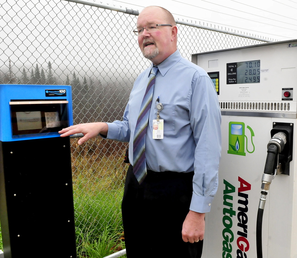 David Leavitt, director of Support Services for RSU 9 in Farmington, speaks beside meters that measure amounts of propane used to fill buses at the bus garage on Wednesday, Oct, 29, 2014. Leavitt said the new fuel will save the school district money.