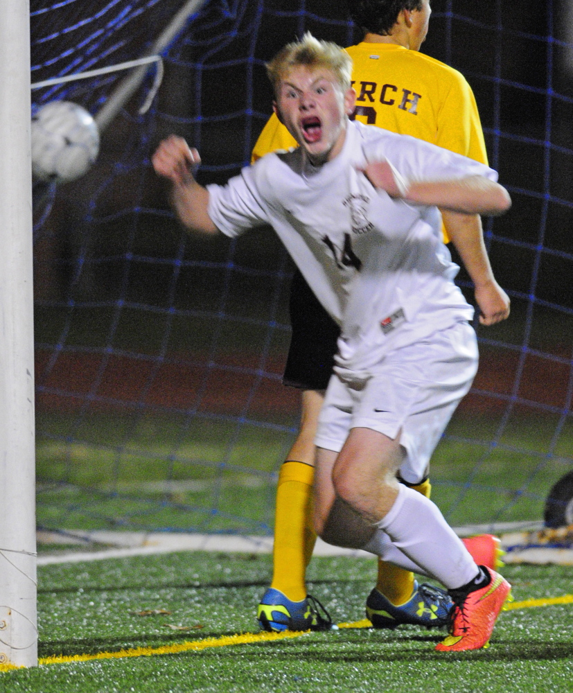 As the ball bounces in the back of net, Richmond’s Brendan Emmons celebrates after scoring what proved to be the game-winning goal in a 1-0 victory over Buckfield in the Western Maine Class D boys soccer final Wednesday at McMann Field in Bath.