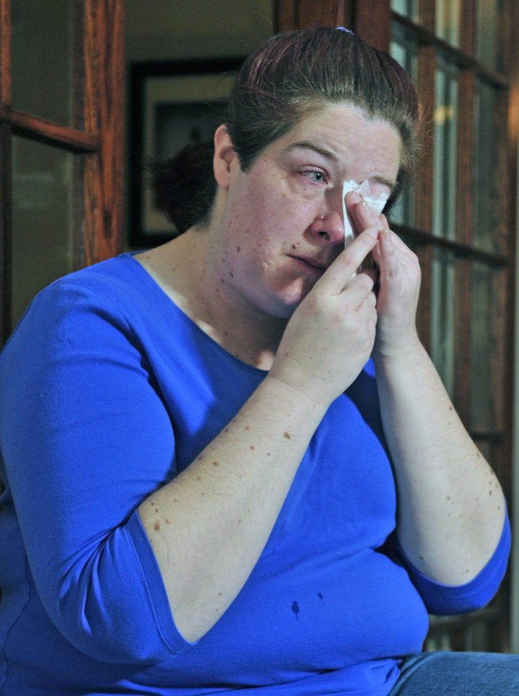 Jen Neumeyer wipes her eyes while talking about her late husband Scott Neumeyer during a May interview in her Augusta home.