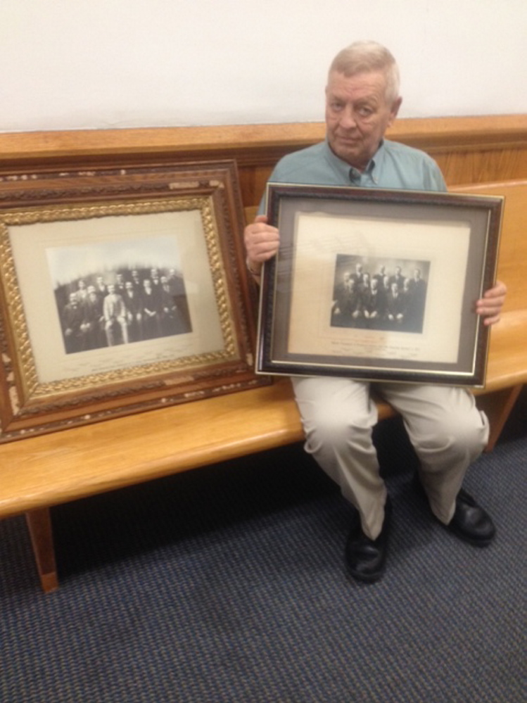 Somerset County Sheriff Barry Delong, who is retiring, holds up a photo from 1913 that he is donating to Somerset County commissioners.