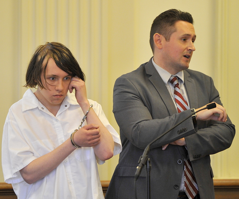 Dylan Lee Collins, 18, left, appears in York County Superior Court with his attorney Friday. James Ford, 21, and Michael Moore, 23, died from injuries sustained in the fire Collins is accused of setting on Sept. 18.