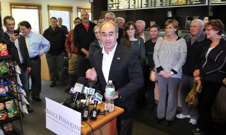 Bruce Poliquin speaks during a news conference Wednesday, surrounded by supporters at the Oakland House of Pizza. He won convincingly Tuesday in his bid to represent Maine’s 2nd Congressional District.