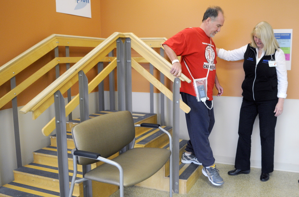 Jim Byrne practices steps with physical therapist Michele Walter in the long-term care and rehabilitation facility at MaineGeneral. The hospital will be celebrating its first anniversary in November. Byrne, of Winslow, is recovering from a stroke.