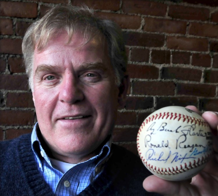 The Rev. Mark Tanner holds a baseball signed by seven U.S. presidents, everyone from Richard Nixon through Barack Obama, with the exception of George W. Bush.