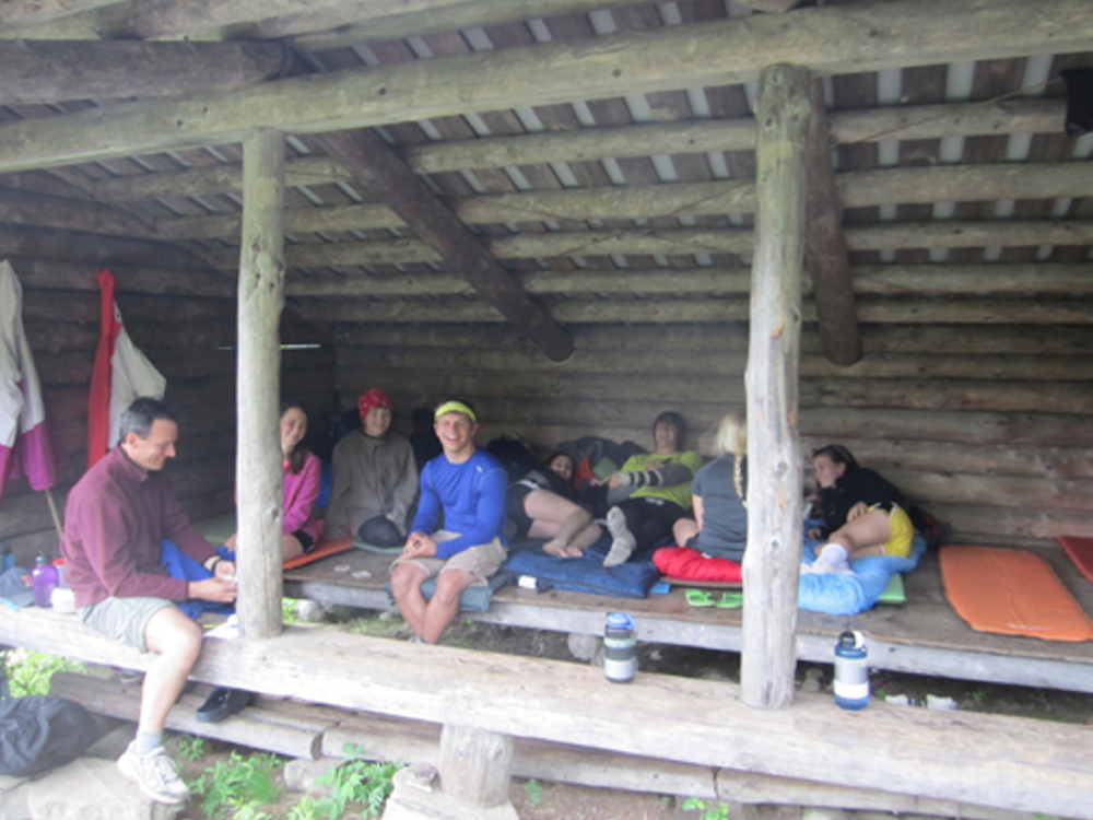 Monmouth Academy Outing Club resting in a shelter after a long day outside. From left are Chris Bryant, Becky Bryant, Emily Levasseur, Stewart Buzzell, Hanna Kerrigan, Garrick Ridlon, Anna Kulinski and Kaitlin Kerrigan.