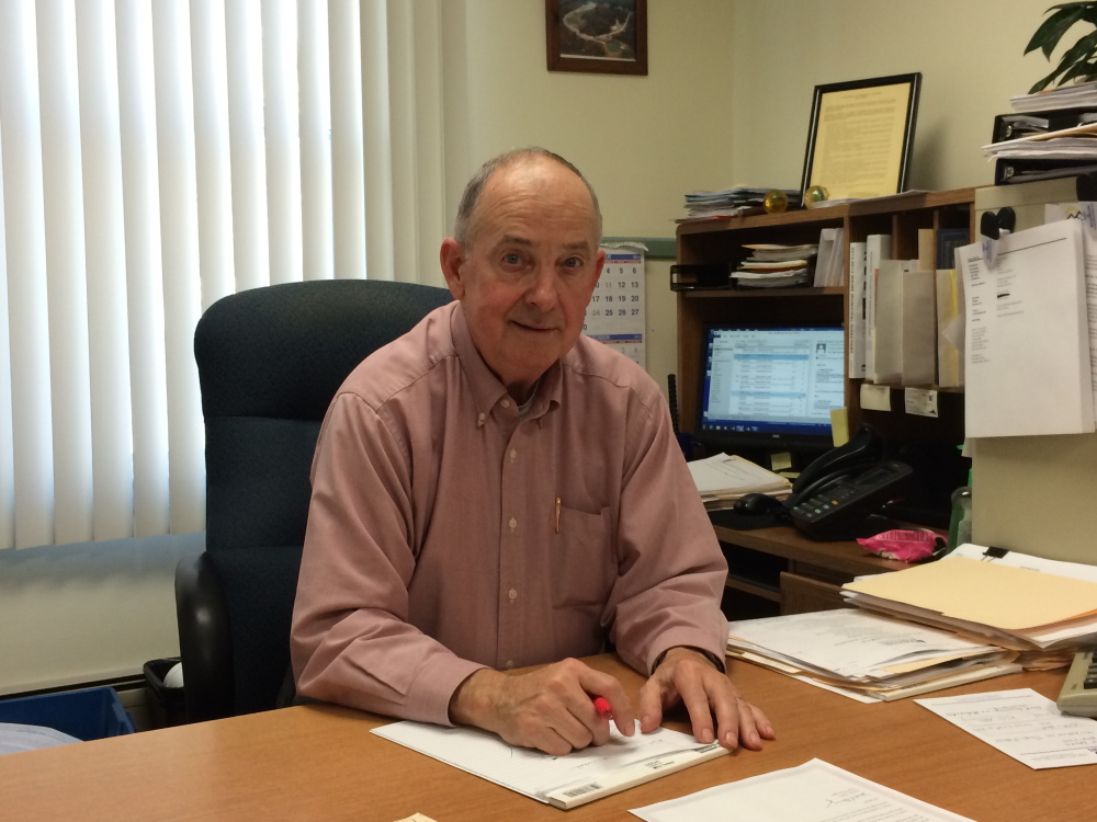 Madison Town Manager Dana Berry, at his desk in October, has retired, and a new town manager will be in place by January.