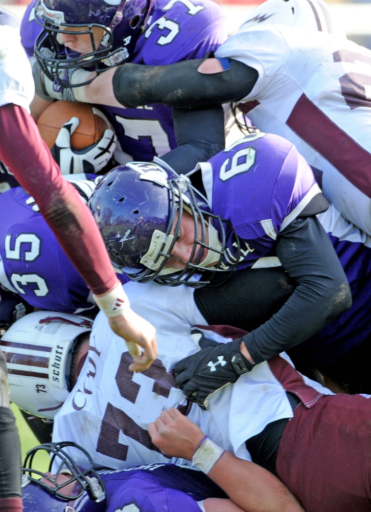Waterville Senior High School’s Alex Danner (66) center, blocks for teammate running back Cam Thomas (37) during a recent game. Danner’s brother Nick was a captain for the Purple Panthers in 2012.
