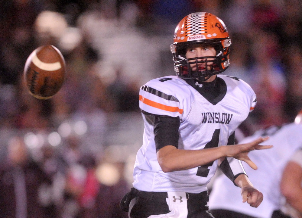 Staff file photo by Michael G. Seamans 
 Winslow High School quarterback Bobby Chenard laterals the ball during an Eastern C game against Foxcroft Academy on Oct. 10.