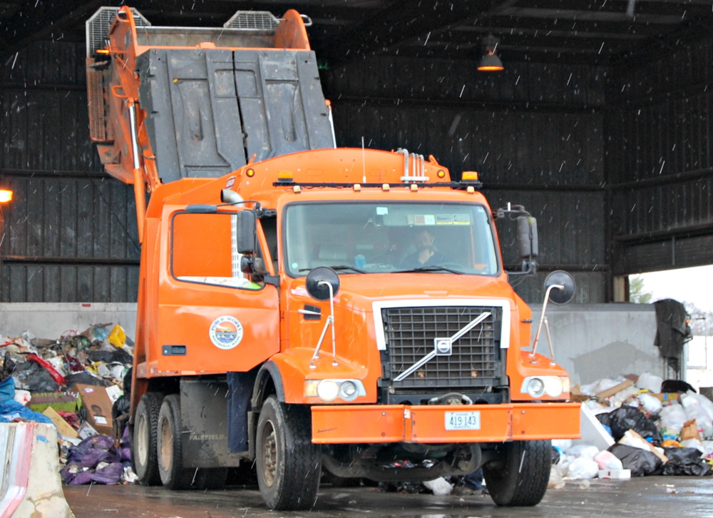 Garbage from Waterville is emptied at the Oakland trash transfer station. A reduction in garbage after Waterville adopted a pay-as-you-throw system has led to a reduction in fees Waterville pays Oakland to use the transfer station.