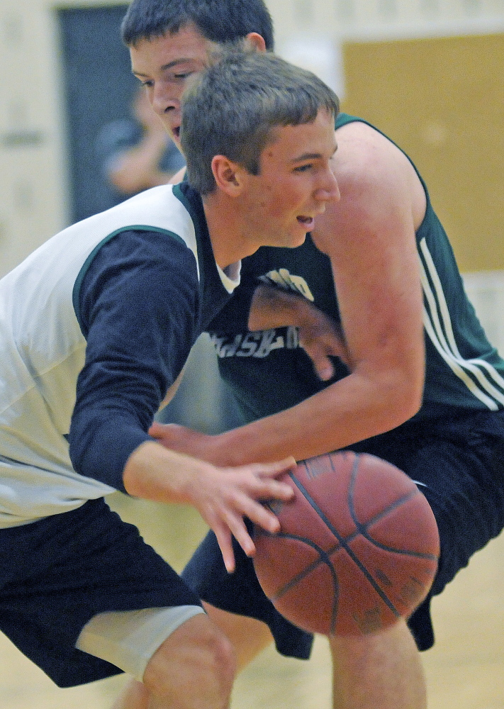 Staff photo by Andy Molloy 
 winthrop's Taylor Morang, left, is guarded by teammate Matt Sekerak on Monday during the first basketball practice of the season.