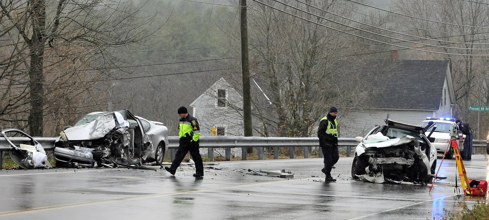 Police and firefighters investigate a two vehicle head-on crash on Tuesday on Eastern Avenue just east of Pleasant Hill Road in Augusta.