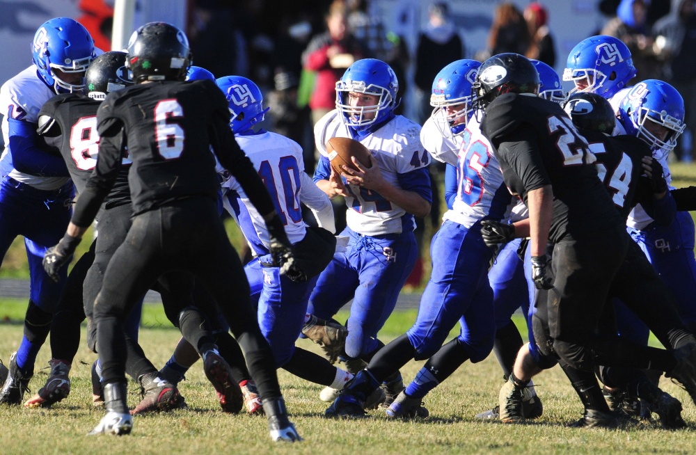 Oak Hill running back Kyle Flaherty finds a hole that his offensive line opened up during the Western D Campbell Conference championship game last Saturday at Lisbon.