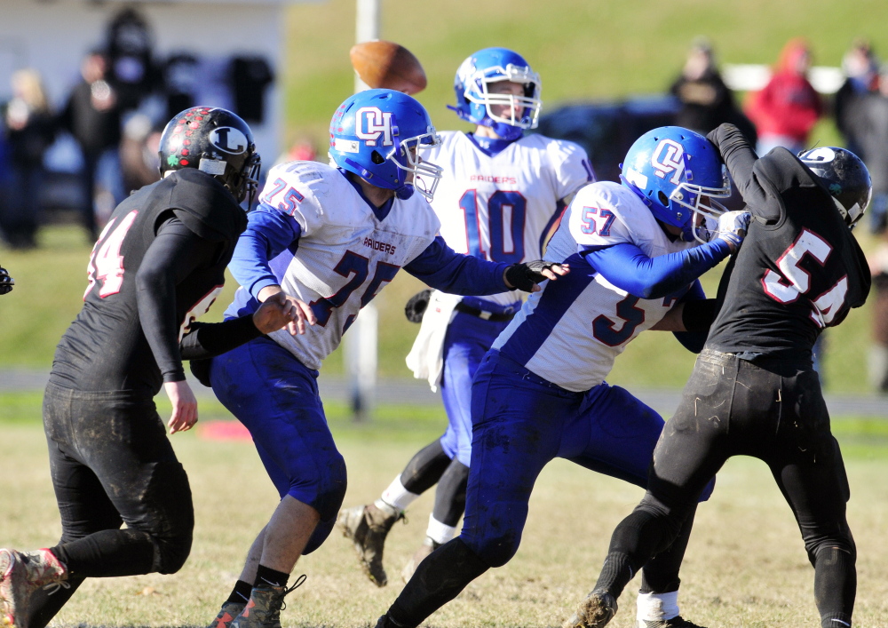 Oak Hill offensive linemen Garrett Gile, left (75), and Connor Elwell (57) protect quarterback Dalton Therrien during the Western D Campbell Conference title game last Saturday against Lisbon.