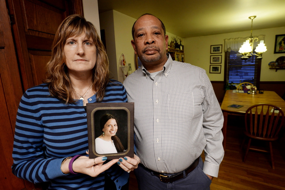 Judith and Wayne Richardson, the parents of Darien Richardson, whose killing in 2010 remains unsolved, hold a photograph of their daughter.