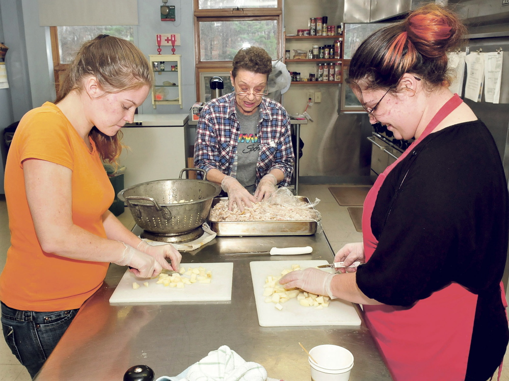 Hot meals are prepared at the St. Anthony’s Soup Kitchen in Skowhegan on Thursday. From left are Amanda Keefe, Carolyn Bowring and Hilarie Cole. The kitchen is open on Monday, Tuesday and Thursday.
