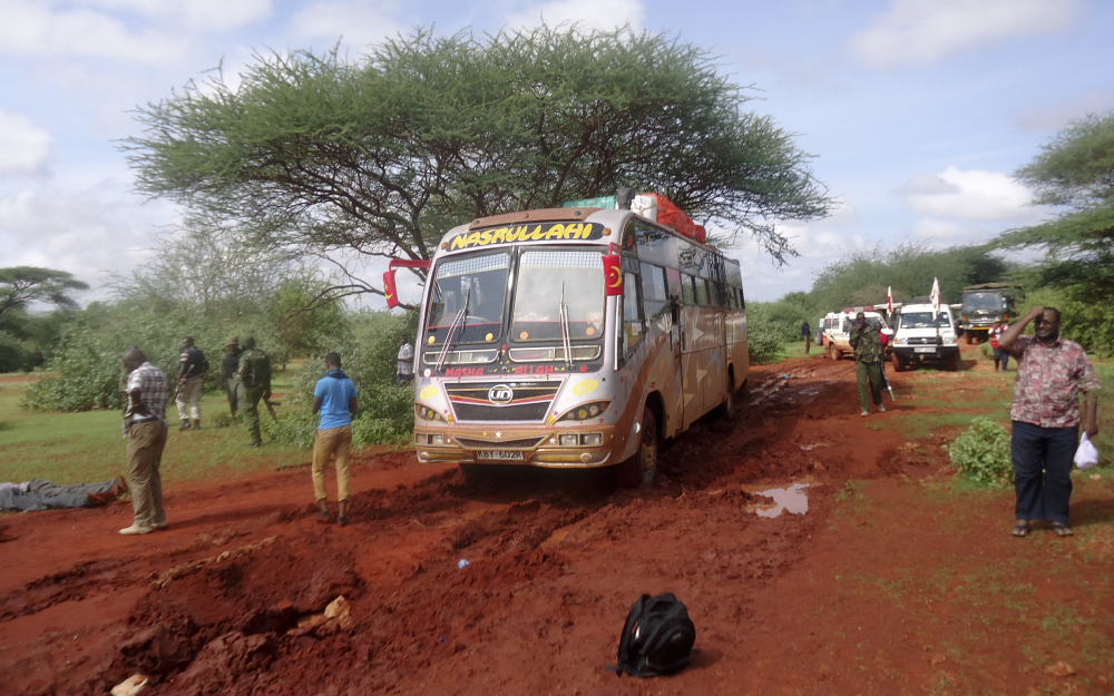 Kenyan security forces and others gather around the scene on an attack on a bus about 31 miles outside the town of Mandera, near the Somali border in northeastern Kenya, on Saturday. Somalia’s Islamic extremist rebels, al-Shabab, attacked the bus in northern Kenya at dawn on Saturday, singling out and killing 28 passengers who could not recite an Islamic creed and were assumed to be non-Muslims, Kenyan police said.