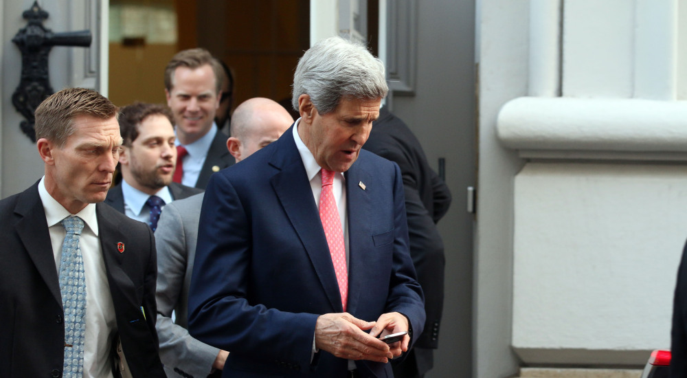 U.S. Secretary of State John Kerry leaves Palais Coburg where closed-door nuclear talks with Iran take place in Vienna, Austria, on Sunday.