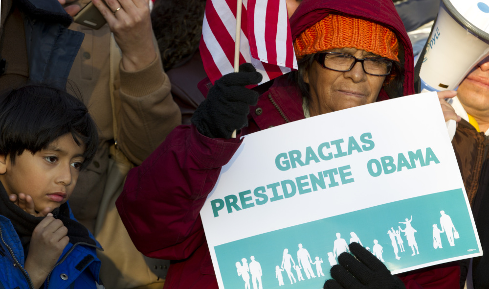 Supporters of immigration reform attend a rally in front of the White House in Washington, Friday, thanking President Obama for his executive action on illegal immigration.