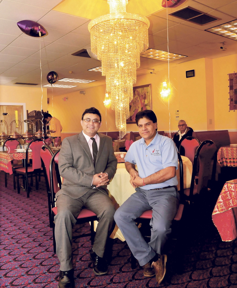 Rishi Malik, left, and Prem Sharma, manager and owner of Waterville’s newest downtown restaurant, bring a departure from mainstream cuisine to the downtown with their Indian fare, a move local leaders hope will help make the city a destination for central Maine diners.