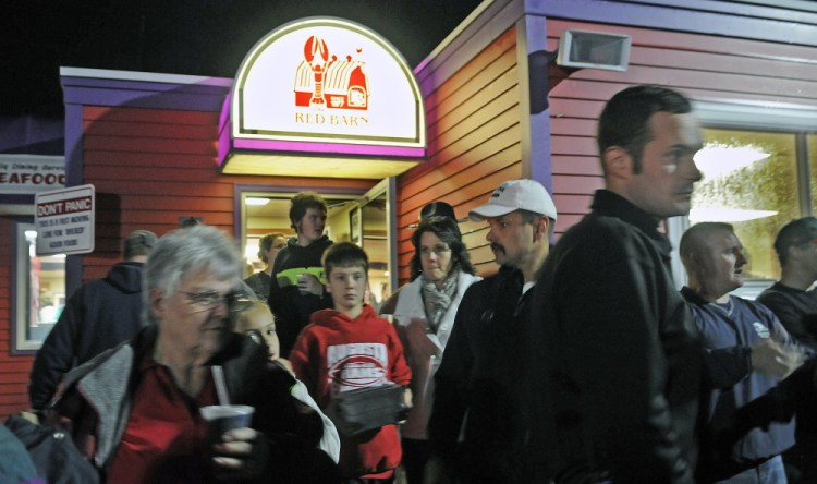 Guests leave the Red Barn in Augusta Monday during a fundraiser for Augusta Police Chief Robert Gregoire.