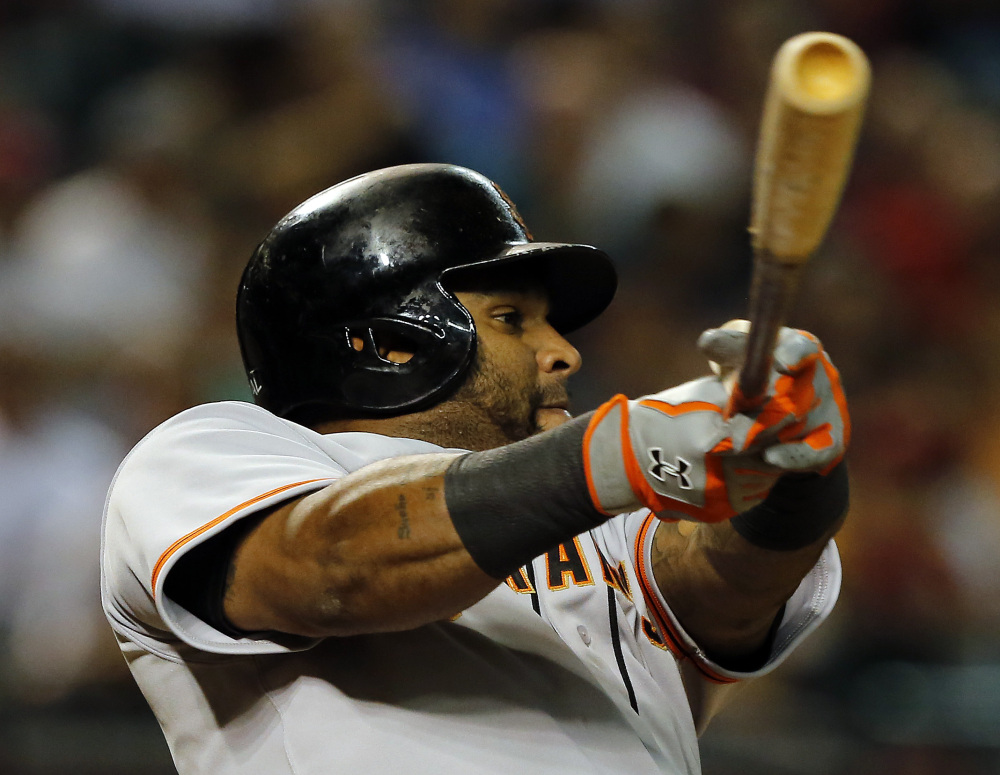 In this Sept. 16, 2014, file photo, San Francisco Giants third baseman Pablo Sandoval (48) bats against the Arizona Diamondbacks in the seventh inning during a baseball game in Phoenix.