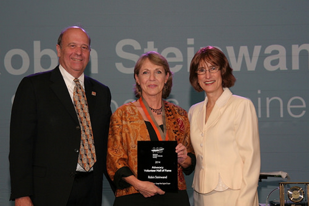 Robin Steinwand, center, at her induction into the National MS Society Volunteer Hall of Fame. From left are Eli Rubenstein, chairman of the National MS Society Board of Directors and vice chair of the Greater New England Chapter, Steinwand, and Cindi Zagieboylo, president and CEO National MS.