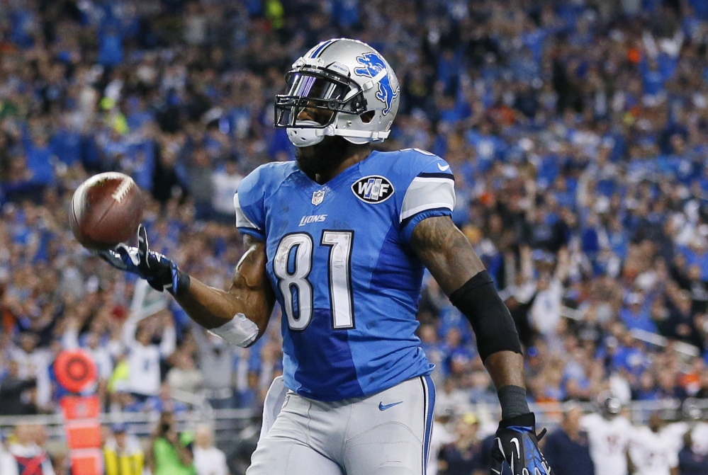 Detroit Lions wide receiver Calvin Johnson tosses the ball after his 25-yard reception for a touchdown during the first half Sunday against the Chicago Bears in Detroit. Johnson had 11 receptions for 146 yards and the Lions won 34-17