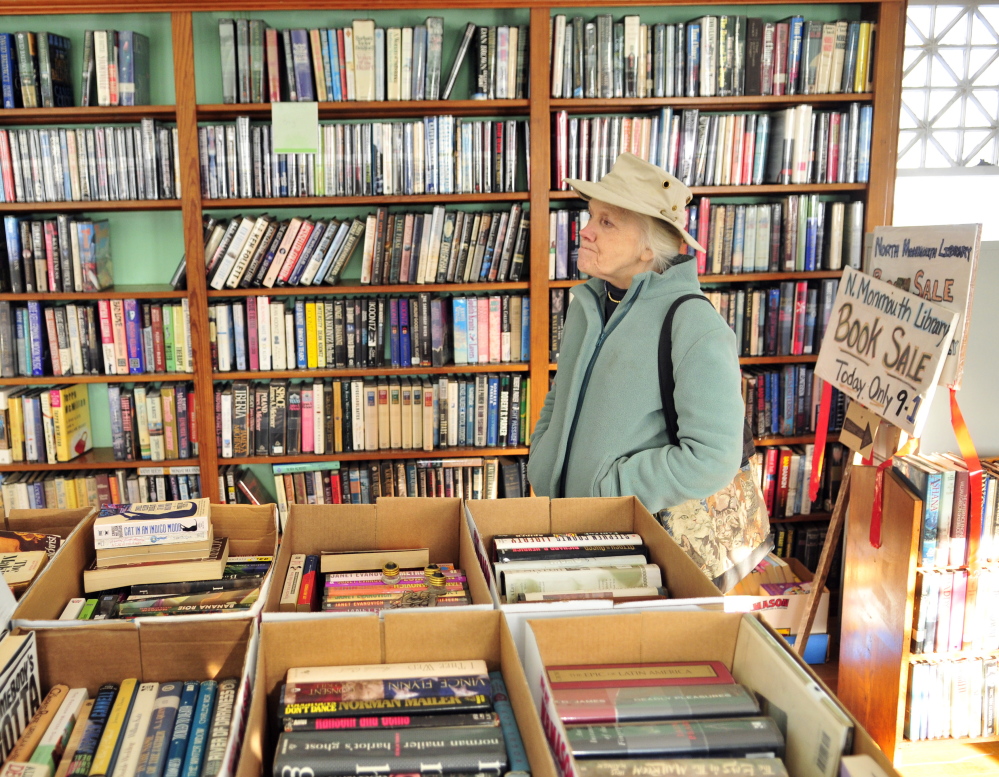 Staff photo by Joe Phelan
North Monmouth Library Association President Shelia Sanford shows the building’s one room library on Friday in North Monmouth.