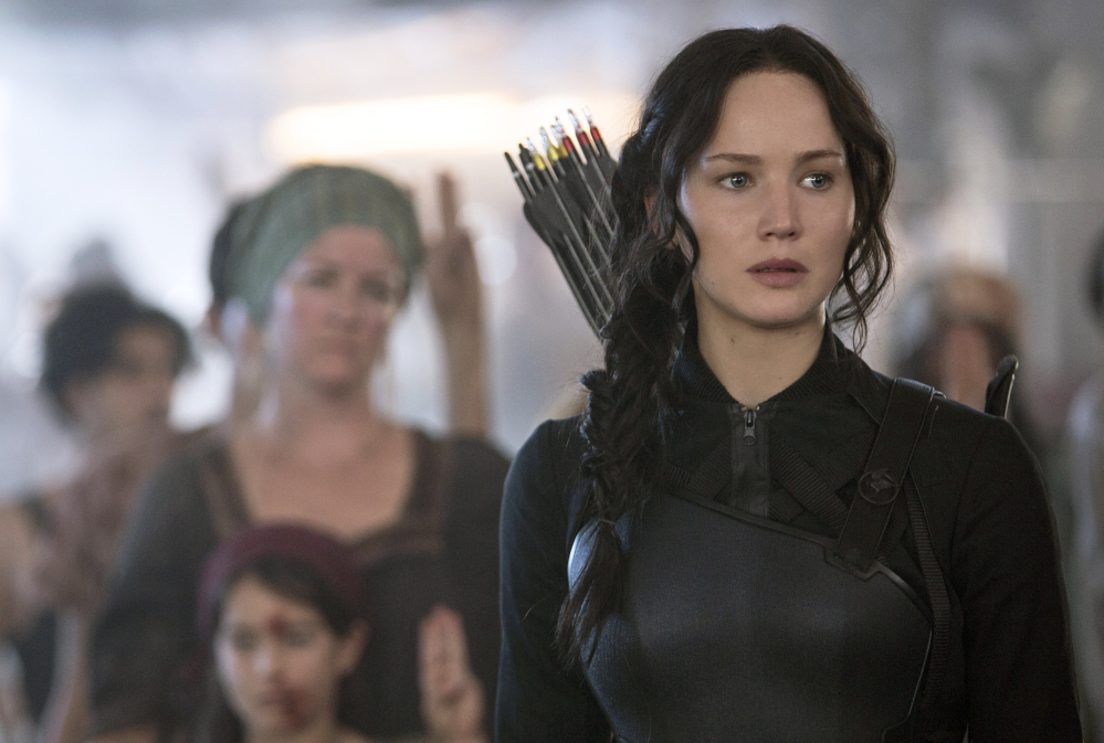 In this image released by Lionsgate, Jennifer Lawrence portrays Katniss Everdeen in a scene from “The Hunger Games: Mockingjay Part 1.”
