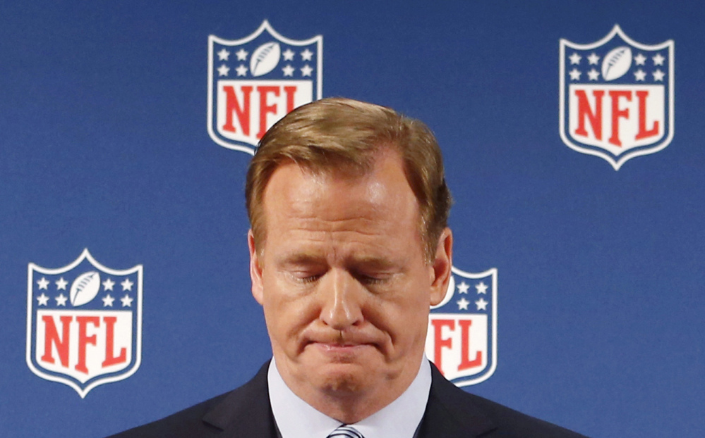 In this Sept. 19, 2014, file photo, NFL Commissioner Roger Goodell pauses as he speaks during a news conference in New York.