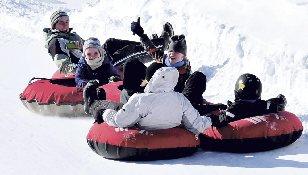 The David Butler family of Winslow spent the day snow-tubing together at the Eaton Mountain Tubing and Ski Area in Skowhegan on Feb. 17, 2014. The mountain was packed with kids and parents in part because of school vacation.