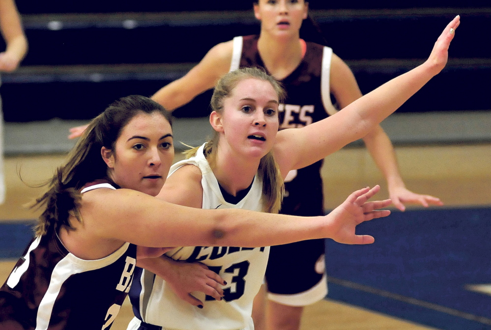 Colby College’s Kate Parsons, right, looks for a pass as Bates’ Allie Coppola defends during a game on Sunday.
