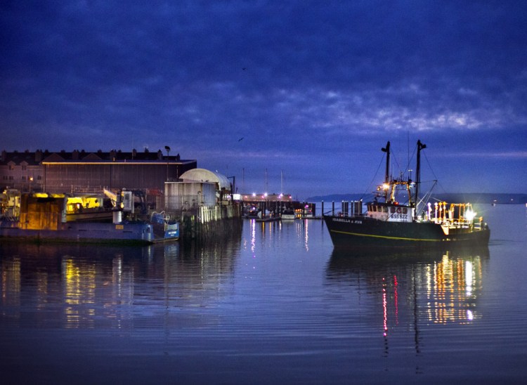 The trawler Isabella and Ava arrives at dawn to unload its catch at the Portland Fish Exchange. New England’s fishery is hoping recent investment from the state in the Portland Fish Exchange can help sustain the facility, which is vitally important to the region’s flagging groundfish industry. Photos by The Associated Press