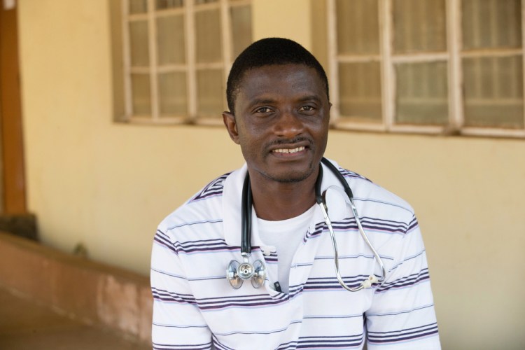 In this April 2014 photo provided by the United Methodist News Service, Dr. Martin Salia poses for a photo at the United Methodist Church’s Kissy Hospital outside Freetown, Sierra Leone. Salia who was diagnosed with Ebola on Monday, landed at Eppley Airfield in Omaha, Neb., Saturday, Nov. 17, 2014, and was being transported to the Nebraska Medical Center. (AP Photo/United Methodist News Service, Mike DuBose.)
