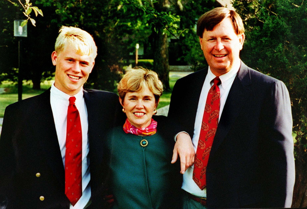 Travis Roy poses with his mother, Brenda, and father, Lee, for a photo in 1995, the year the young hockey player had the accident that left him paralyzed.