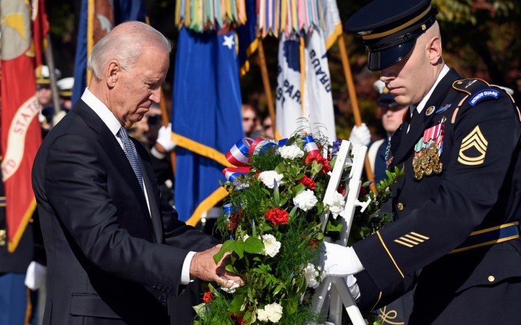Vice President Joe Biden lays a wreath at the Tomb of the Unknowns Tuesday at Arlington National Cemetery.
