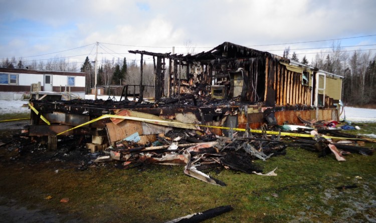 A home at the Westgate Mobile Home Park in Caribou was destroyed by fire Thursday. A woman and three young children died in the fire reported around 7 a.m. 