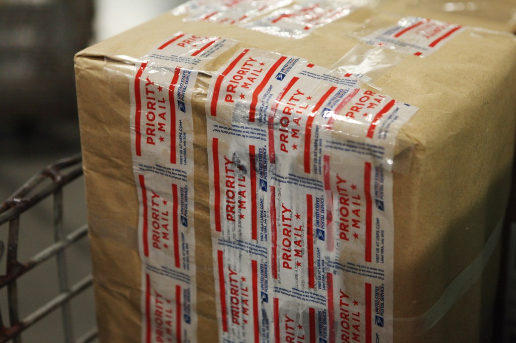 A Priority Mail package is on its way to its receiver after being processed at the USPS sorting facility in Scarborough. Joel Page/Staff Photographer