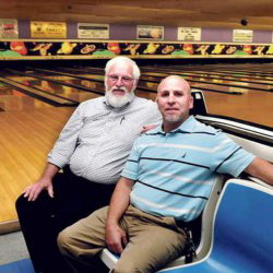 Sparetime Recreation bowling alley owner Andy couture, left, and the Rev. Craig Riportella of the Centerpoint Community Church sit at the Waterville bowling alley last September. The city solicitor has ruled no zoning change is needed to allow the church to buy the bowling alley property.