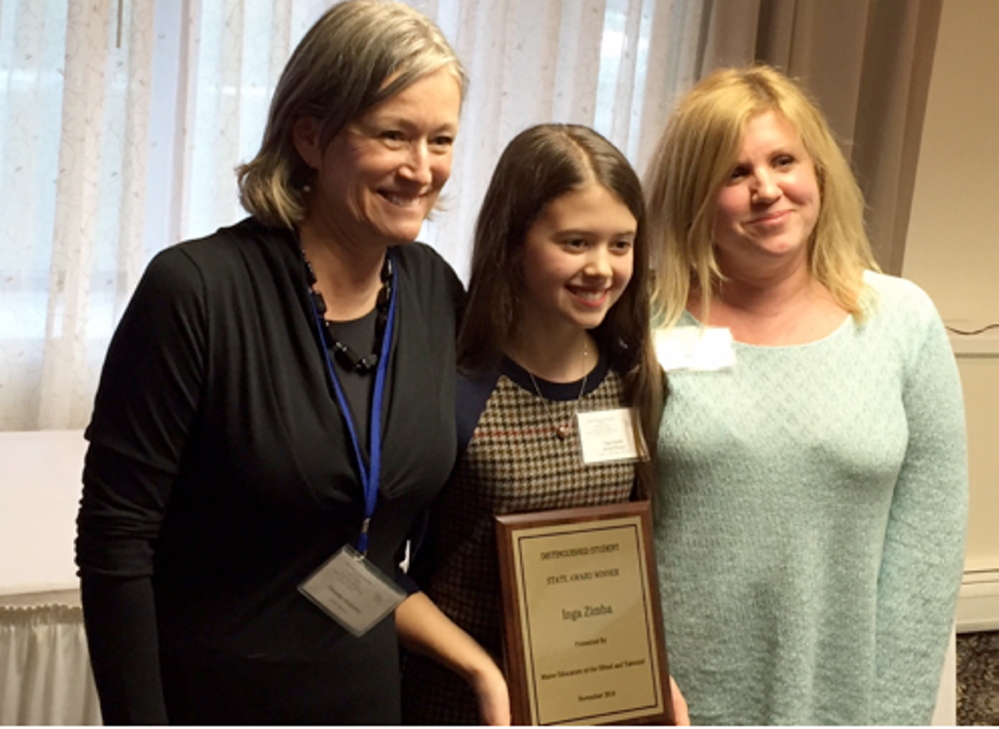 At the MEGAT Awards Banquet, from left, are Tina Serdjenian, teacher of K-5 gifted and talented students, Inga Zimba, and Hollie Hilton, Hall School art teacher.