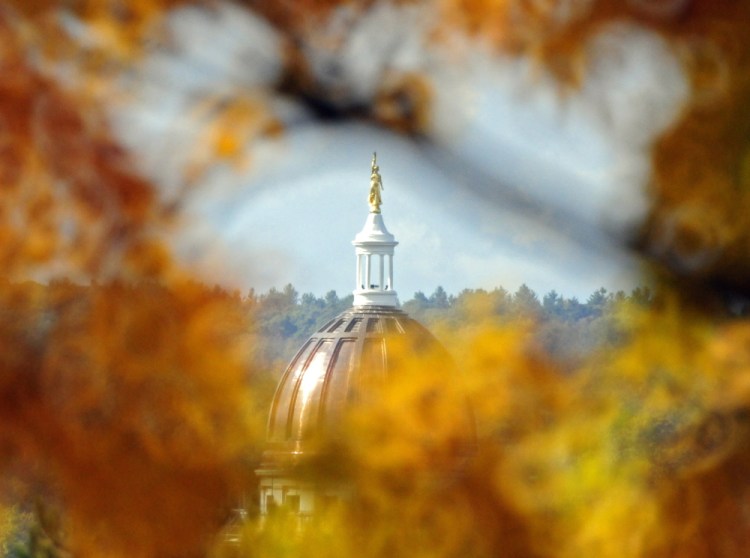 The newly refurbished State House dome, framed by fall foliage from the east side of Augusta in October.