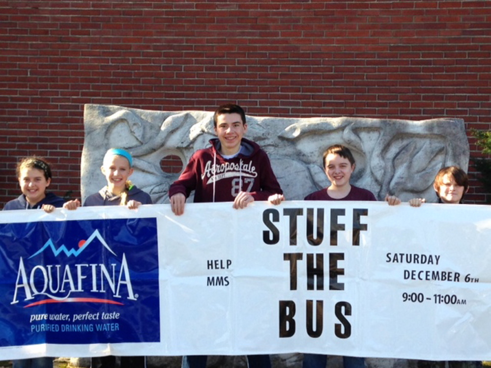 Monmouth Middle School students will participate in a Stuff the Bus event on Saturday. From left are Morgan Crocker, Mariah Herr, Ben Brooks, John McCabe and Jordan Hammond.