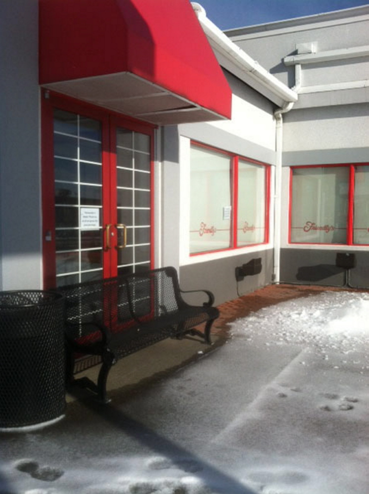 A bench blocks the door at Friendly’s at 373 Main St. in Waterville. The restaurant closed suddenly this week.