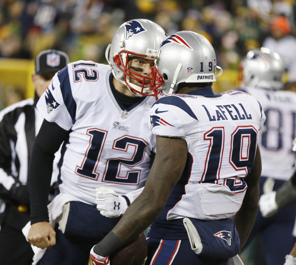 New England Patriots’ Tom Brady (12) celebrates Brandon LaFell’s touchdown catch during the second half Sunday against the Green Bay Packers in Green Bay, Wis. The Patriots play the San Diego Chargers on Sunday.