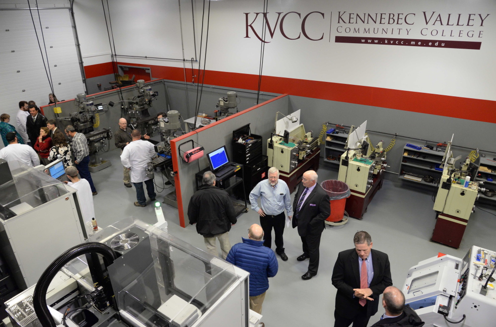 Visitors at an open house in the updated Kennebec Valley Community College precision machining technology laboratory.