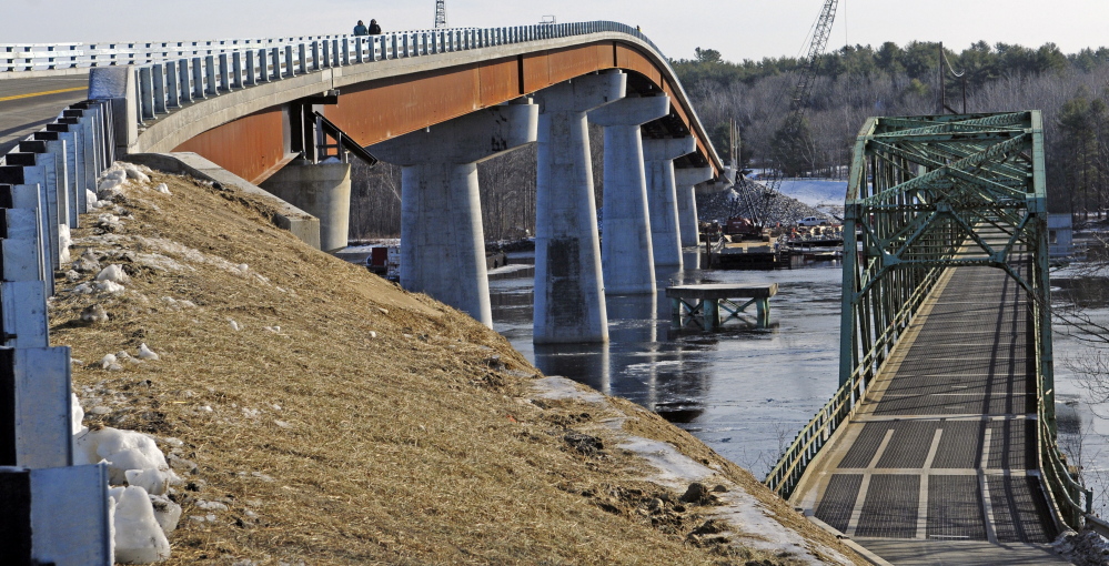 The old bridge is seen, at right, after the opening ceremony on Friday for the new bridge over the Kennebec River between Richmond and Dresden.