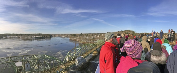 The old bridge is seen in the background during the opening ceremony on Friday for the new bridge over the Kennebec River between Richmond and Dresden.