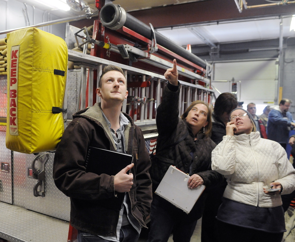 University of Maine at Augusta architecture students tour the interior of the Randolph fire station Monday.