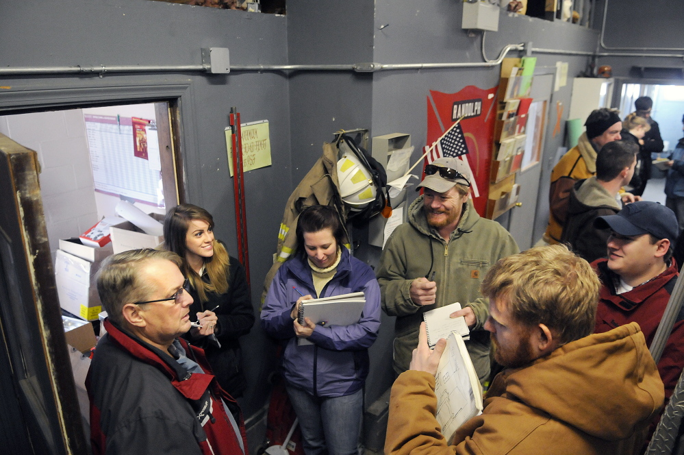 University of Maine at Augusta architecture students interview Randolph Fire Chief Ron Cunningham, left, during a tour of the Randolph fire station on Monday.